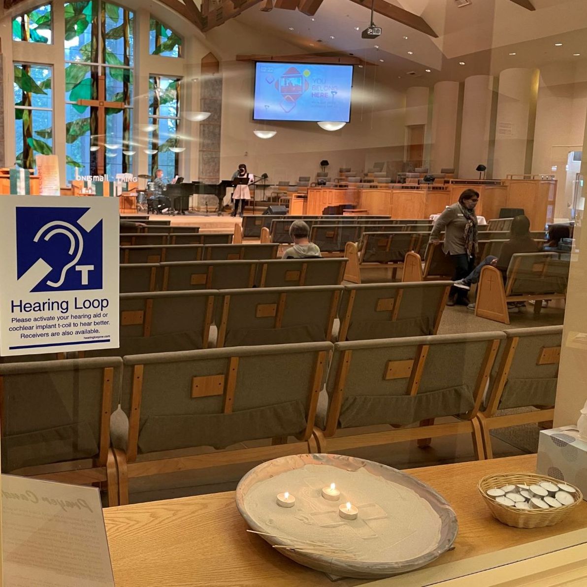 church sanctuary with a sign about hearing loop use.
