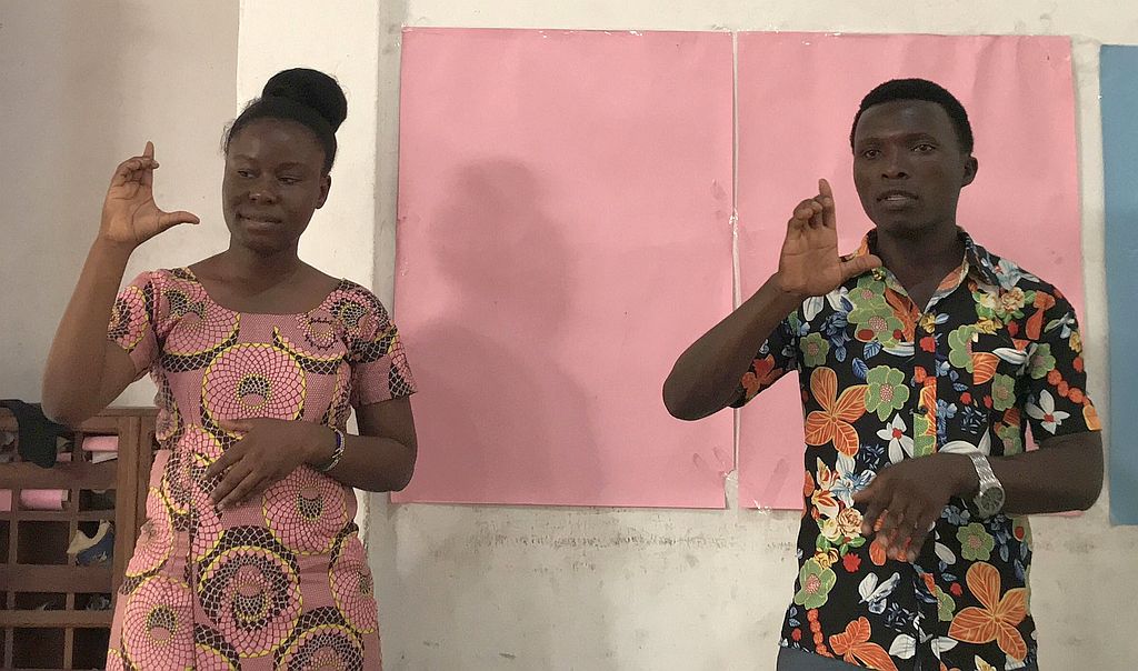 two class teachers demonstrating sign language