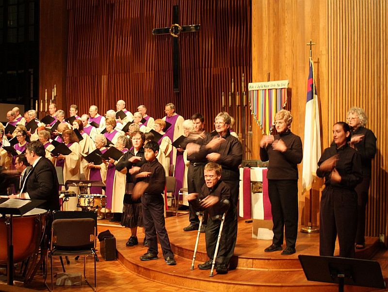 photo of Lovers Lane Sign Choir at a Good Friday service; they are on step risers next to the adult choir.