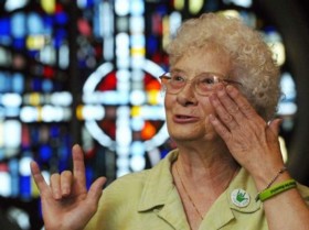 photo of Barbara Reynolds, signing