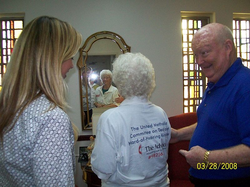 Mellissa Stump, John Denmark, with Barbara Reynolds in the middle, Barbara's back is shown, her shirt has the Advance logo and DHM number.