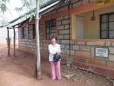 Helen in front of her home