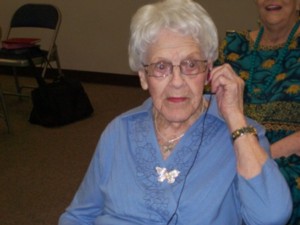 photo of woman using hearing device