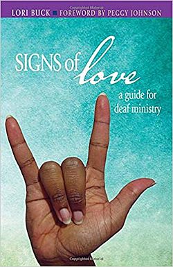 cover of Signs of Love, shows an aqua background with the sign I Love You.